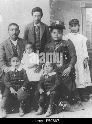 N/A. English: Delia Naukana, in a studio portrait with her first husband, George Napoleon Parker, and children taken during an 1890 visit to Tacoma from the Gulf Islands. According to family lore, Delia's husband, a recently arrived Hawaiian, was related to the family that owned the large Parker Ranch. not given. Photo courtesy of Rosemary Tahouney Unger 433 Delia and George N. Parker's family Stock Photo