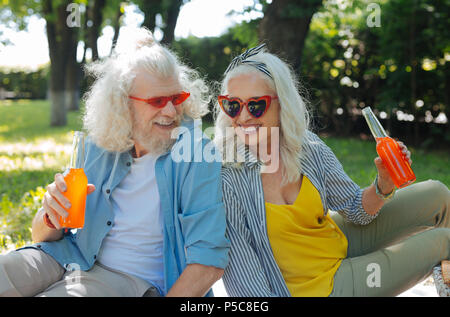 Delighted joyful couple being in a great mood Stock Photo