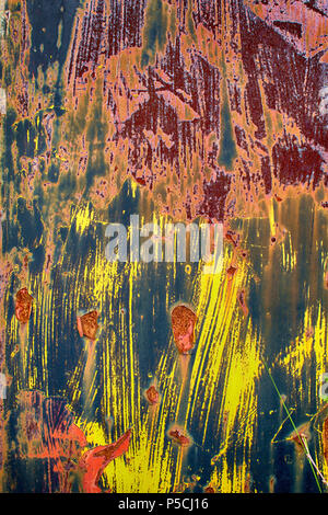 Closeup of rusty, colorful metal wall as background. Stock Photo
