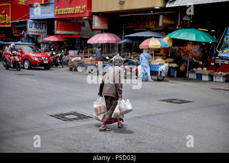 Elderly woman crossing the street. Thailand Southeast Asia Stock Photo ...