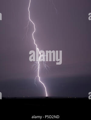 Single bolt of lightning hits ground from a solitary thunderstorm Stock ...