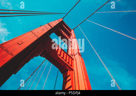 Beautiful low angle view of famous Golden Gate Bridge with blue sky and clouds on a sunny day in summer with retro vintage post crocessing filter effe Stock Photo