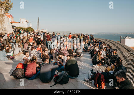 Lisbon, 01 May 2018: Many young people of local people, tourists and migrants on the city lookout platform which is a meeting place for young people and communication between them Stock Photo