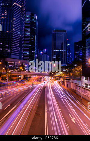 HONG KONG - JUNE 02, 2018: Light trails of traffic at night in central Hong Kong Stock Photo