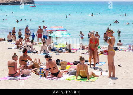 Young women sunbathing on the beach, Castries, St. Lucia, Caribbean