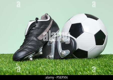sports equipment on green grass background Stock Photo - Alamy