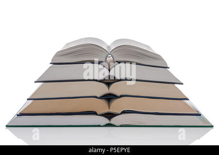 A pile of five open hardback books isolated on a white background. Stock Photo