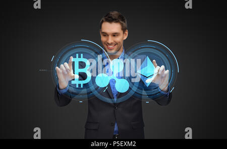 businessman with cryptocurrency holograms Stock Photo