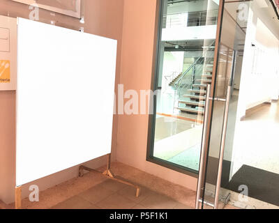 Indoor blank billboard posters in the building. Empty advertising billboard at university Stock Photo