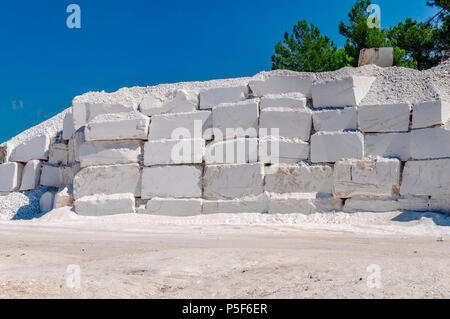 Big white blocks of raw marble in a quarry in Greece Stock Photo