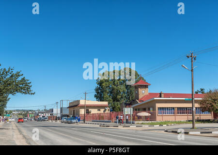 ELLIOT, SOUTH AFRICA - MARCH 28, 2018: A street scene, with the Town Hall, businesses, vehicles and people, in Elliot in the Eastern Cape Province Stock Photo