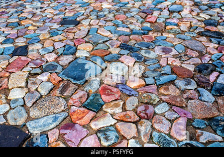 Old cobblestone roadway as creative background texture Stock Photo