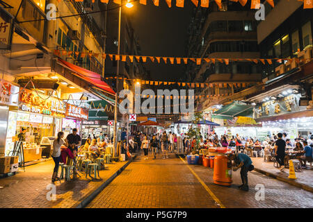 HONG KONG - JUNE 01, 2018: People shopping at Temple Street night market in Kowloon Hong Kong Stock Photo