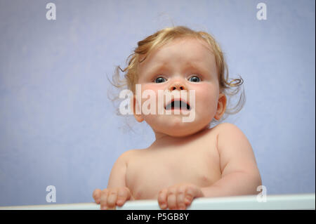 Frightened baby girl Stock Photo