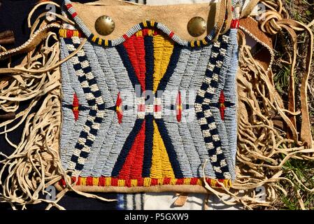 Close up of traditional Native American designed bead pattern on hand crafted pouch on display at Bloody Lake Rendezvous, Woodford, Wisconsin, USA Stock Photo