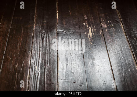 Macro grungy background of cracked rough and weathered floorboard. Stock Photo