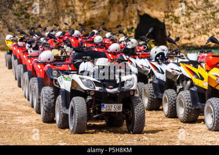 Line of quad bikes queued up ready for riders, Gozo, Malta Stock Photo