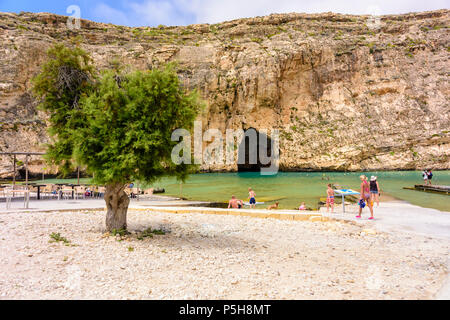 Dwerja, the inland sea, Gozo, Malta.  The cave joins with the Mediterranean sea on the other side of the cliff. Stock Photo
