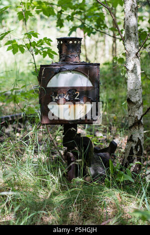 The railway lamp on the old station. Railway equipment for servicing train traffic. Season of the summer. Stock Photo