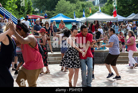 Couples dance at the Hola Asheville Festival, celebrating Latin American culture, in Asheville, NC, USA Stock Photo