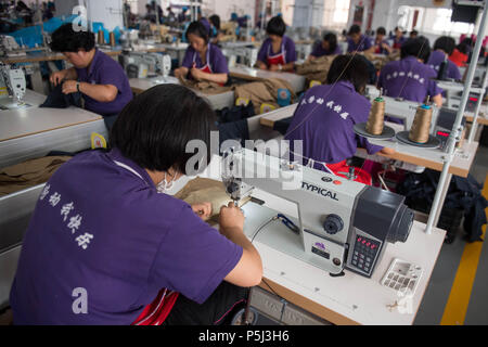 Kunming, China's Yunnan Province. 26th June, 2018. Members of a drug rehabilitation center for female work at the center in Kunming, southwest China's Yunnan Province, June 26, 2018. The center provides not only detoxification treatment but also behavior shaping, psychological rehabilitation and vocational training to help drug addicts get rid of addiction. June 26 marked the International Day against Drug Abuse and Illicit Trafficking. Credit: Hu Chao/Xinhua/Alamy Live News