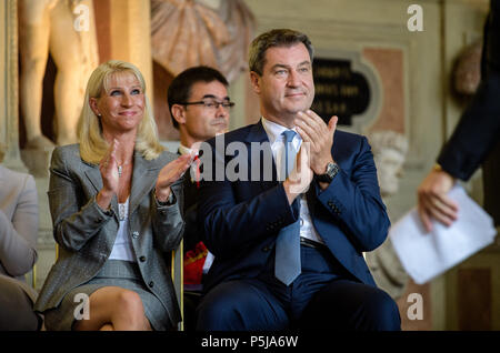 Munich, Germany. 27th June, 2018. Premier of Bavaria, Markus Soeder of the Christian Social Union (CSU), and his wife Karin applaud during the presentation of the Bavarian Order of Merit in the Antiquarium of the residence. Credit: Matthias Balk/dpa/Alamy Live News Stock Photo