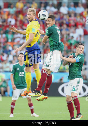 Yekaterinburg, Russia. 27th June, 2018. Ola Toivonen (L top) of Sweden vies with Hector Moreno (R top) of Mexico during the 2018 FIFA World Cup Group F match between Mexico and Sweden in Yekaterinburg, Russia, June 27, 2018. Credit: Li Ming/Xinhua/Alamy Live News Stock Photo