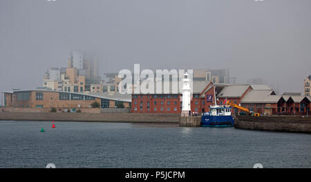 Scotland, 27 June 2018, unlike other areas the sun eventually showed up in Edinburgh around mid-morning after a very misty start with coastal haar but on the east coast in Granton Leith the mist and haar began to move in again late afternoon. Stock Photo