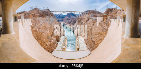 Classic view of famous Hoover Dam, a major tourist attraction located on the border between the states of Nevada and Arizona, on a beautiful sunny day Stock Photo