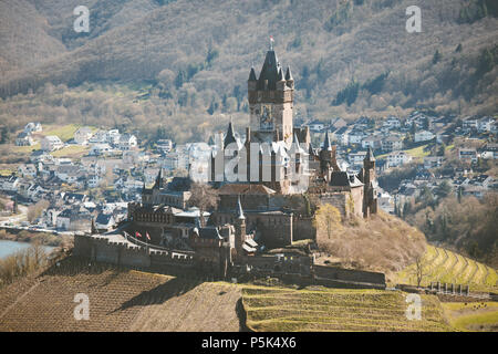 Historic town of Cochem with famous Reichsburg castle on top of a hill and scenic Moselle river on a sunny day, Rheinland-Pfalz, Germany Stock Photo