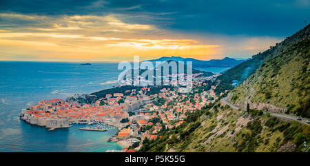 Panoramic aerial view of the historic town of Dubrovnik, one of the most famous tourist destinations in the Mediterranean Sea, in beautiful golden eve Stock Photo