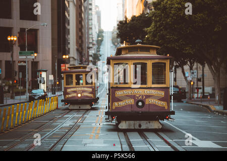 Classic view of historic San Francisco Cable Cars on famous California Street at sunset with retro vintage filter effect, California, USA
