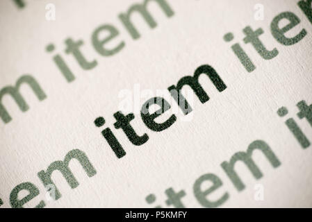 word item printed on white paper macro Stock Photo