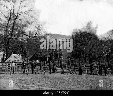 N/A. English: Appomattox Court House, Va. Federal soldiers at the courthouse April 1865 . April 1865.   Timothy H. O'Sullivan  (1840–1882)     Alternative names Timothy O'Sullivan; T. H. O'Sullivan; Timothy O’Sullivan  Description American photographer, war photographer and journalist  Date of birth/death 1840 17 January 1882  Location of birth/death Ireland Staten Island  Work location United States of America  Authority control  : Q1371063 VIAF:14902578 ISNI:0000 0000 8359 2179 ULAN:500005788 LCCN:n82020572 NAID:1733522 WorldCat 115 Appomattox courthouse Stock Photo