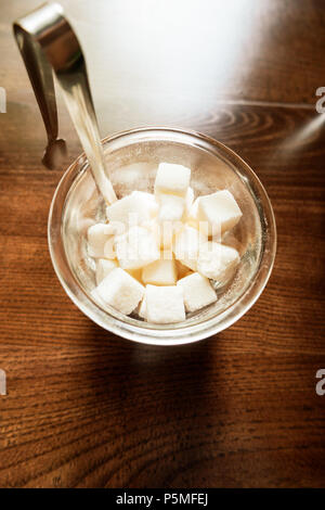 Sugar in the bowl top view on wooden background Stock Photo