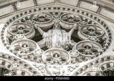 The front of the Cathedral Church of Saint John the Divine in NYC.  Upper part of portal of Paradise. Stock Photo