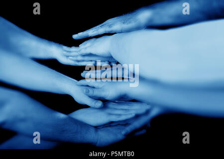 conceptual image of hands together Stock Photo