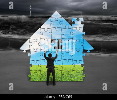 Building puzzles house with beautiful landscape for bad situation outside Stock Photo