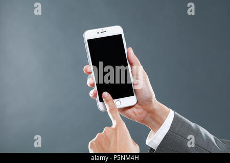 Hands holding smartphone Stock Photo