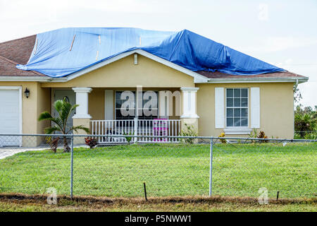 Fort Ft. Myers Florida,Lehigh Acres,after Hurricane Irma storm wind damage destruction aftermath,blue tarp waterproof covering roof,house houses home Stock Photo