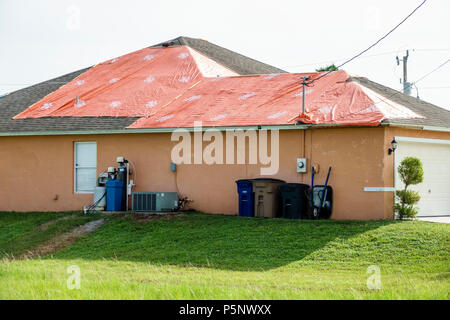 Fort Ft. Myers Florida,Lehigh Acres,after Hurricane Irma storm wind damage destruction aftermath,tarp waterproof covering roof,house houses home house Stock Photo