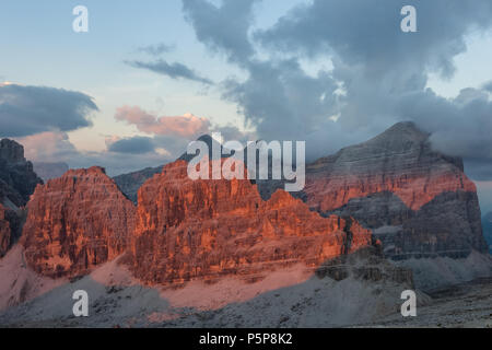 Awesome enrosadira effect on Tofane and Lagazuoi peaks, Lagazuoi, veneto, Italy Stock Photo