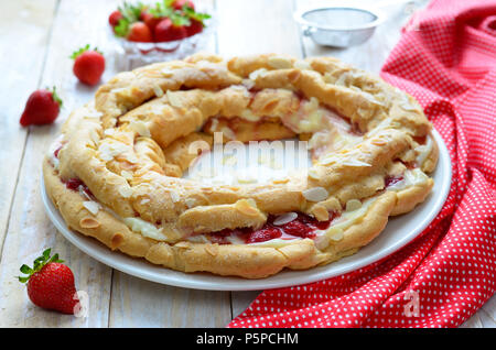 Strawberry cake with custard and choux pastry on white background Stock Photo