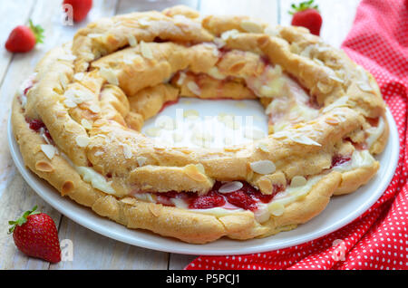 Strawberry cake with custard and choux pastry on white background Stock Photo