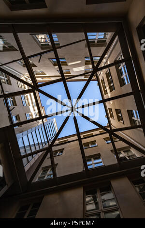 Tallinn, Estonia - May 1, 2016: interior of an old living house courtyard covered with glass roof Stock Photo