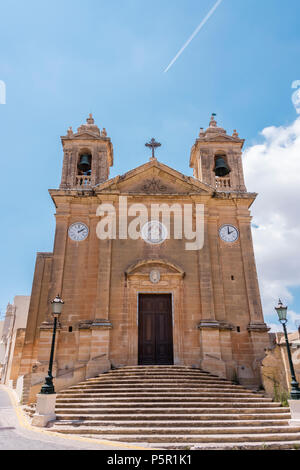 Ghajnsielem old parish church, Gozo, Malta, with two clocks, one set ten minutes after the other in keeping with Maltese folklore. Stock Photo