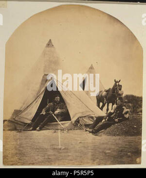 N/A. An officer and non-commissioned officer of the 57th regiment, reclining in front of a tent, during the regiment's time of service in the Crimean War. A servant and a horse are visible in the background. Cropped from original to remove excess border. 1855.   Roger Fenton  (1819–1869)     Description British photographer, journalist, artist and war photographer  Date of birth/death 28 March 1819 6 August 1869  Location of birth/death Lancashire Potters Bar  Work period c.1851-1869  Authority control  : Q345666 VIAF:66536514 ISNI:0000 0000 6647 3397 ULAN:500017263 LCCN:nr88002241 Open Librar Stock Photo