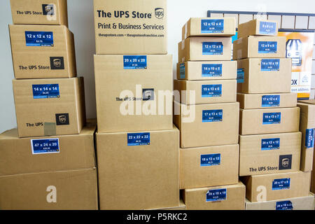 Miami Beach Florida,UPS Store,business,interior inside,shipping,printing services,stacked cardboard boxes,different sizes,FL171015001 Stock Photo