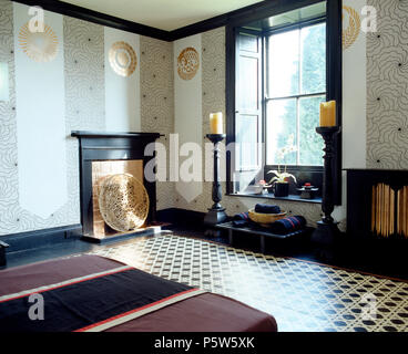 Large Candles In Giant Sized Candlesticks On Either Side Of Window