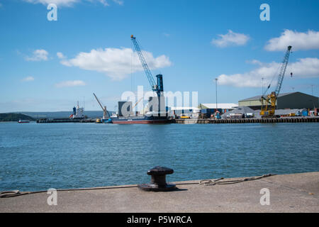 The Valiant - Alderney Shipping Company - Channel Seaways Lineage Ship being loaded with shipping containers on a sunny Summers Day in June 2018. Stock Photo